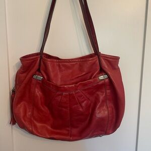 B Makowsky red leather shoulder bag with tassels & silver detail.